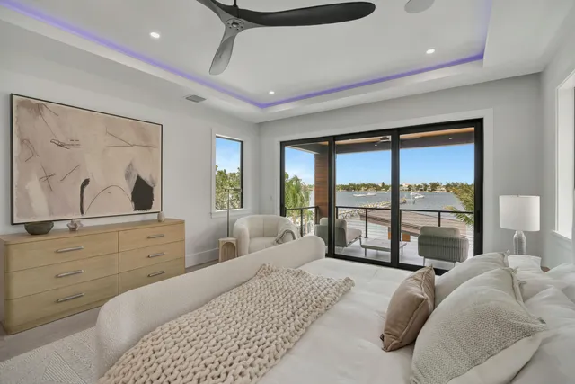 a view of a living room with a floor to ceiling window and stairs