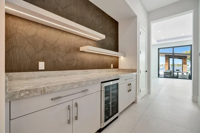 a view of an empty room with swimming pool and outdoor space
