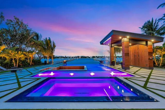 a living room with furniture kitchen view and a window