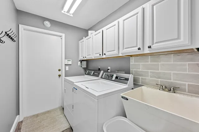 a bathroom with a sink a toilet and a bathtub