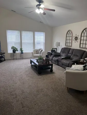 a living room with furniture and window