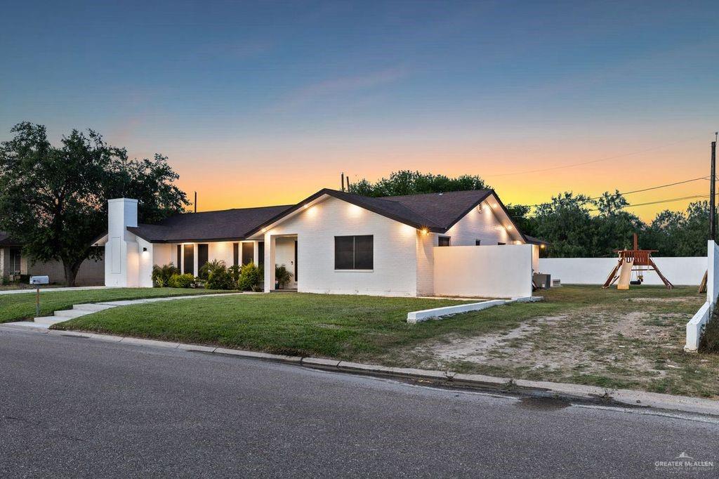 111 South Cox Street Rio Grande City, TX 78582 - Photo 2 of 27 Ranch-style house with a playground and a chimney