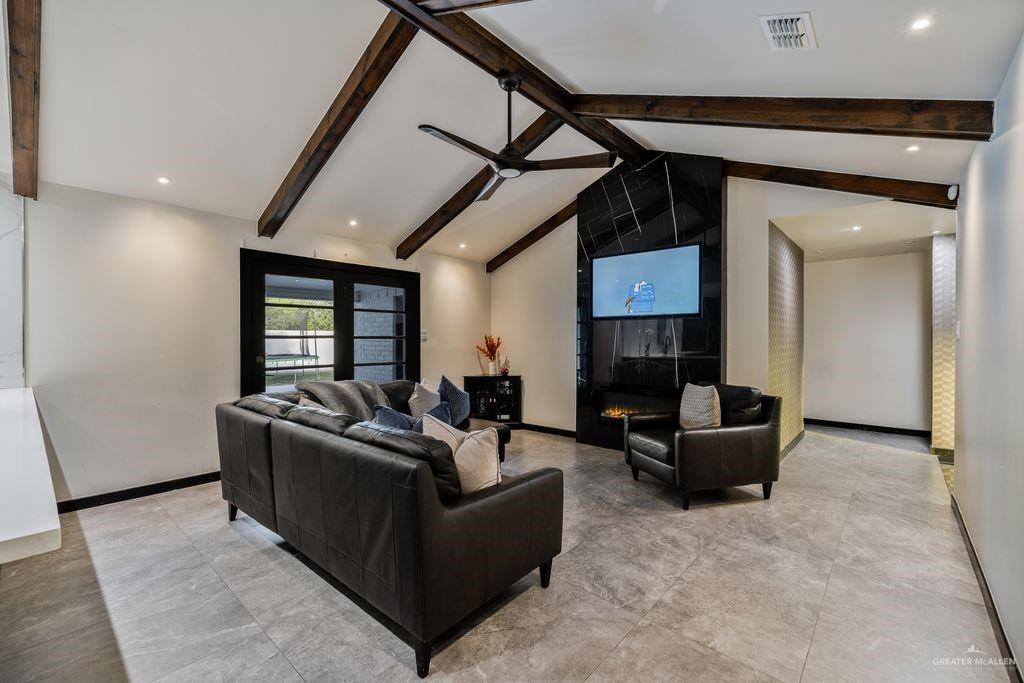 111 South Cox Street Rio Grande City, TX 78582 - Photo 4 of 27 Living area with ceiling fan, a fireplace, and recessed lighting