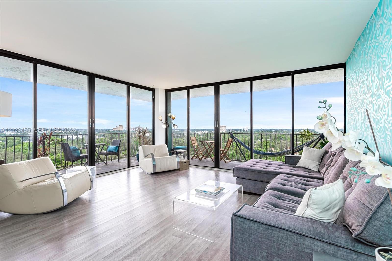 780 Northeast 69th Street, Unit 1010 Miami, FL 33138 - Photo 9 of 31 a living room with furniture and a large window