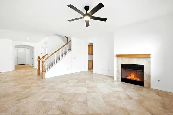 a view of an empty room with a fireplace