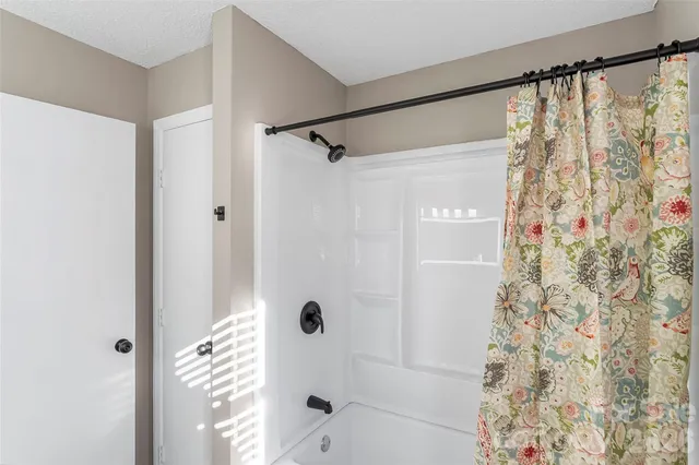 a view of a house with a yard covered with snow in front of house