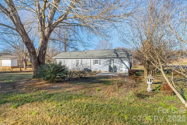a view of a house with a snow on the road