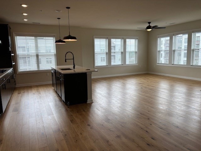 4 Stratton Drive, Unit 301 Woburn, MA 01801 - Photo 11 of 24 an empty room with wooden floor and windows