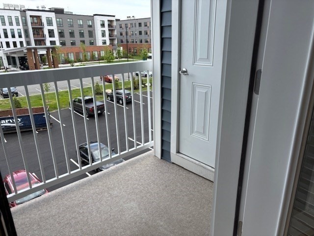 4 Stratton Drive, Unit 301 Woburn, MA 01801 - Photo 14 of 24 a view of a balcony