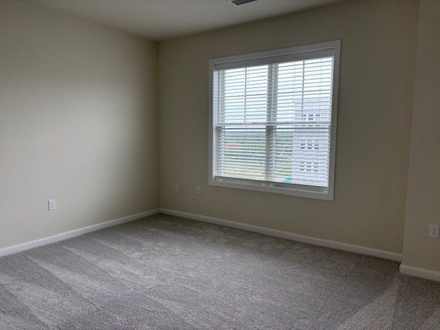 4 Stratton Drive, Unit 301 Woburn, MA 01801 - Photo 18 of 24 an empty room with a window