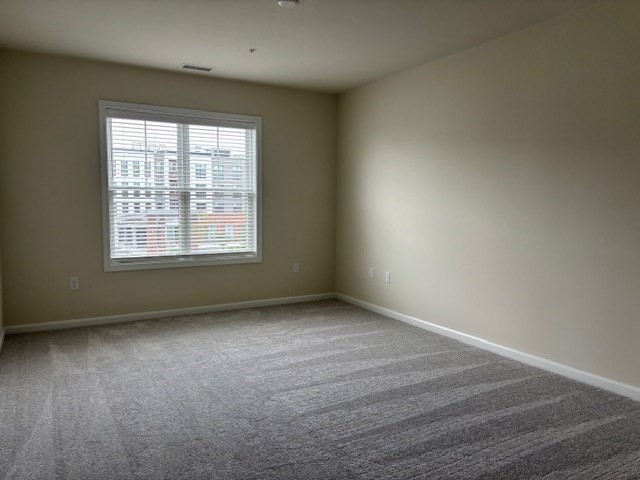 4 Stratton Drive, Unit 301 Woburn, MA 01801 - Photo 20 of 24 an empty room with a window