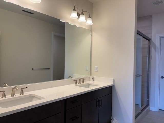 4 Stratton Drive, Unit 301 Woburn, MA 01801 - Photo 22 of 24 a bathroom with a sink and a mirror