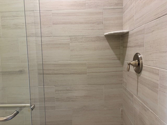 4 Stratton Drive, Unit 301 Woburn, MA 01801 - Photo 24 of 24 a bathroom with a shower