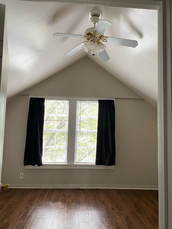 800 Travis Street, Unit ATTIC Columbus, TX 78934 - Photo 6 of 6 wooden floor in an empty room with a window