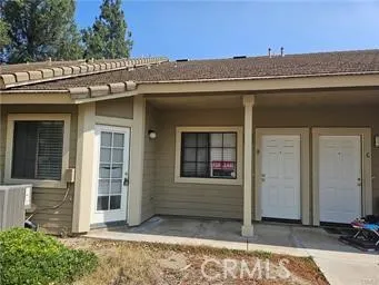 a view of a house with a door and wooden walls