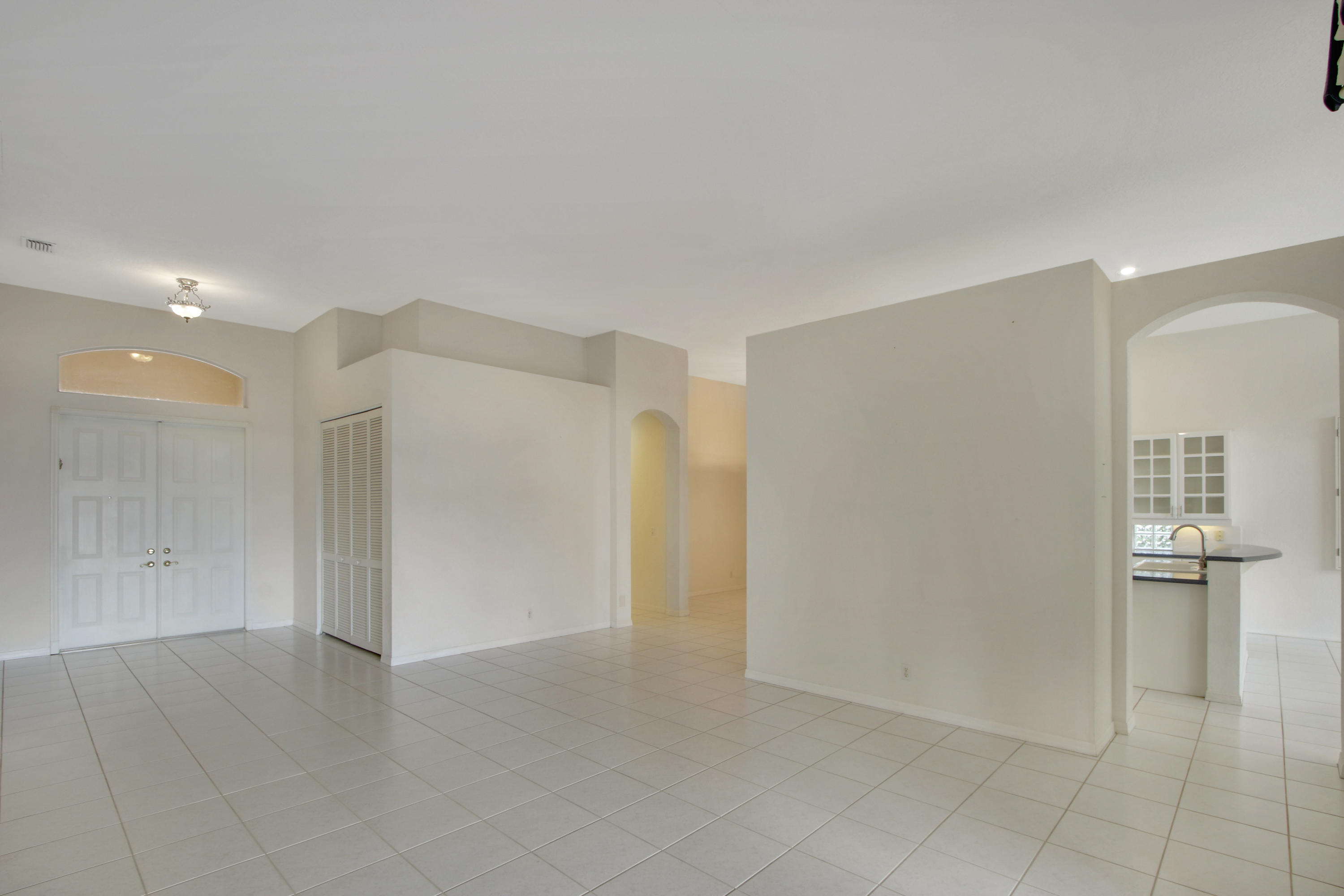 18561 Ocean Mist Drive Boca Raton, FL 33498 - Photo 7 of 29 Living Room to Front Door