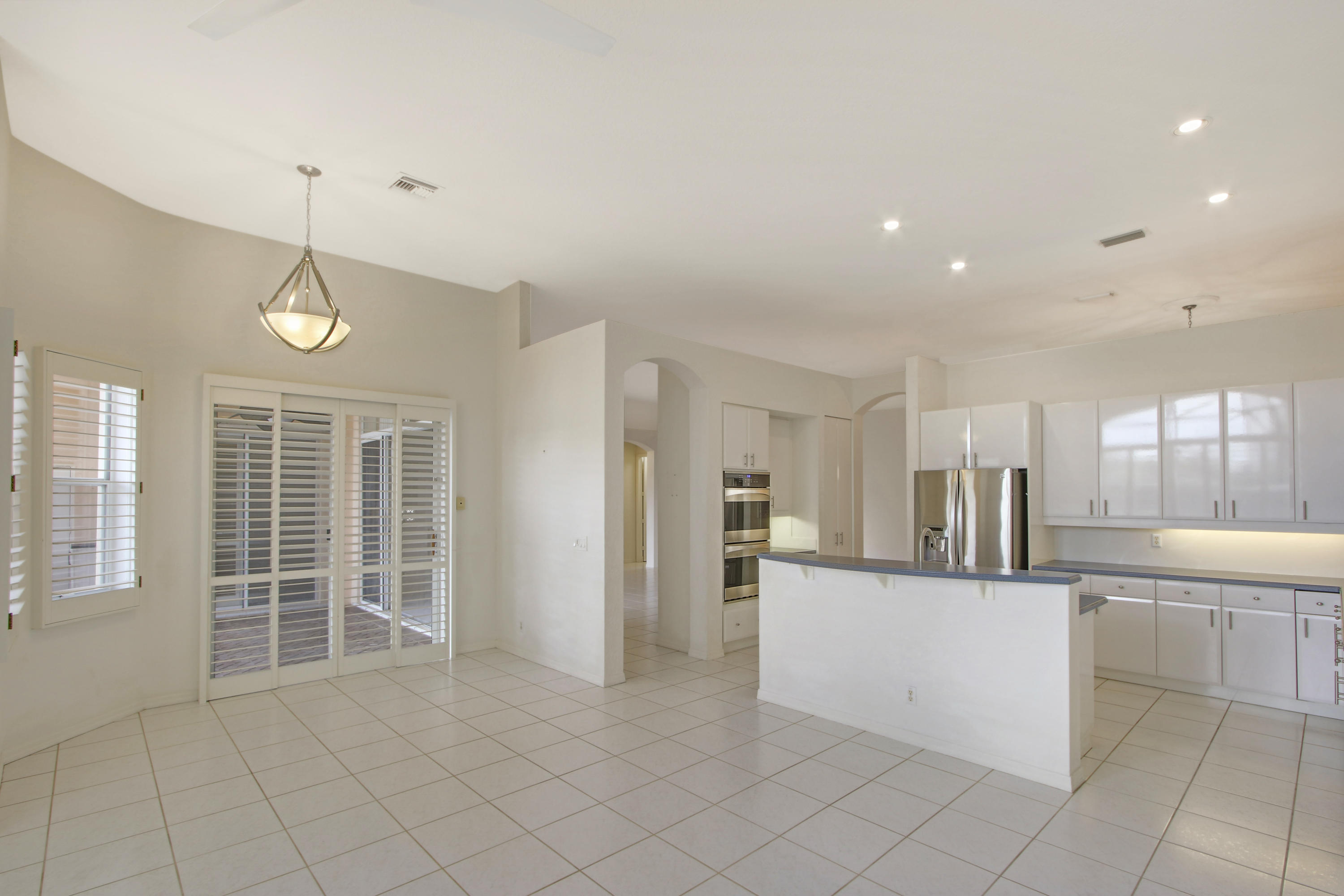 18561 Ocean Mist Drive Boca Raton, FL 33498 - Photo 10 of 29 Family Room to Kitchen