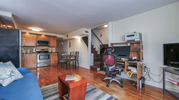 a view of a kitchen with dining table and chairs