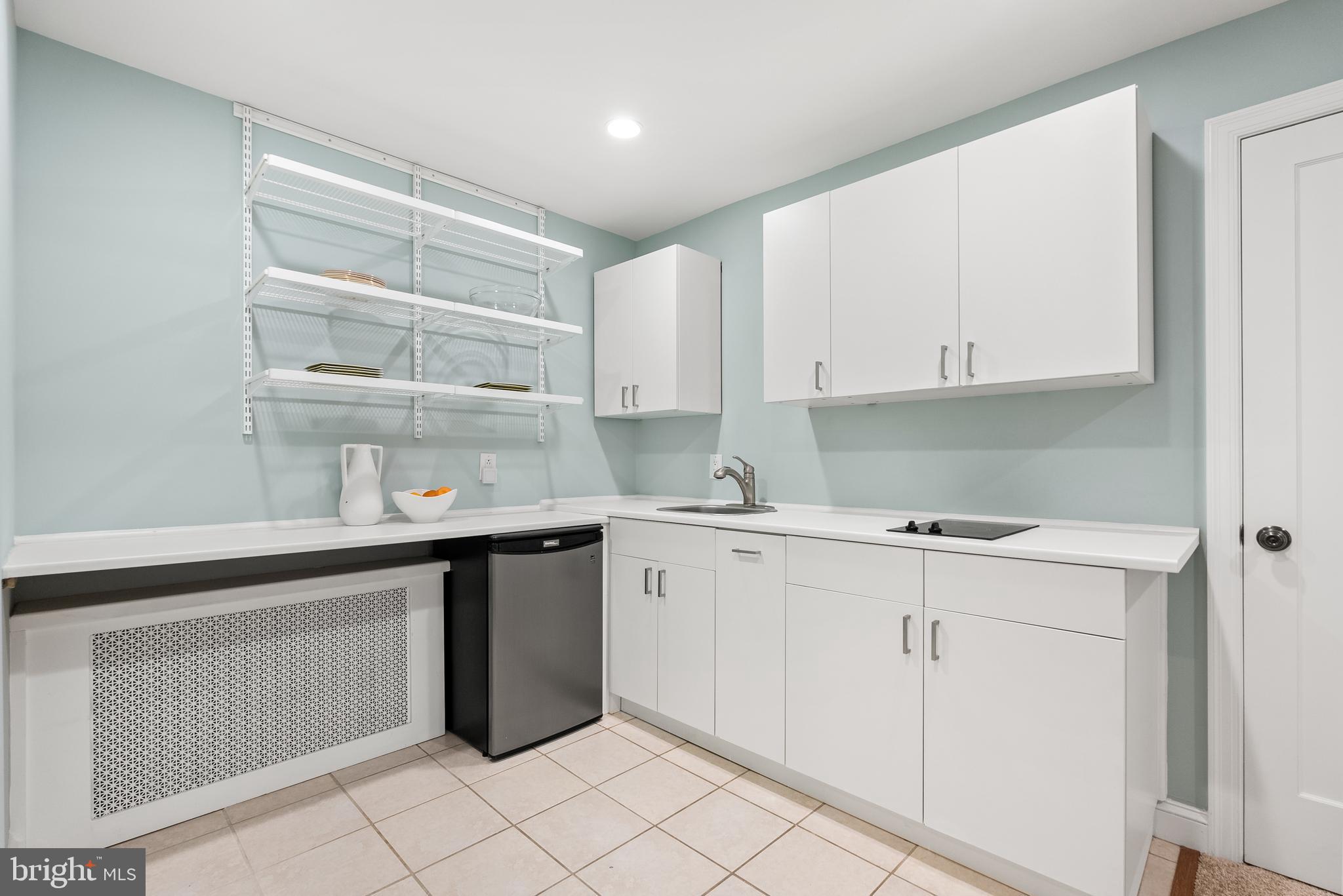 2812 39th Street Northwest Washington, DC 20007 - Photo 21 of 33 A full white kitchenette with table space