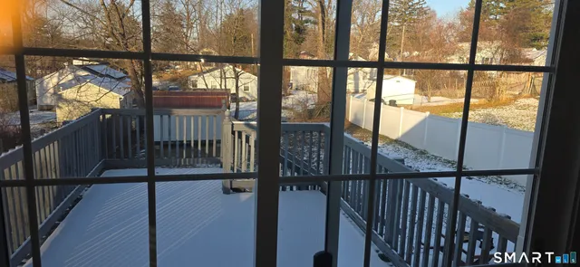 a view of a backyard with wooden fence