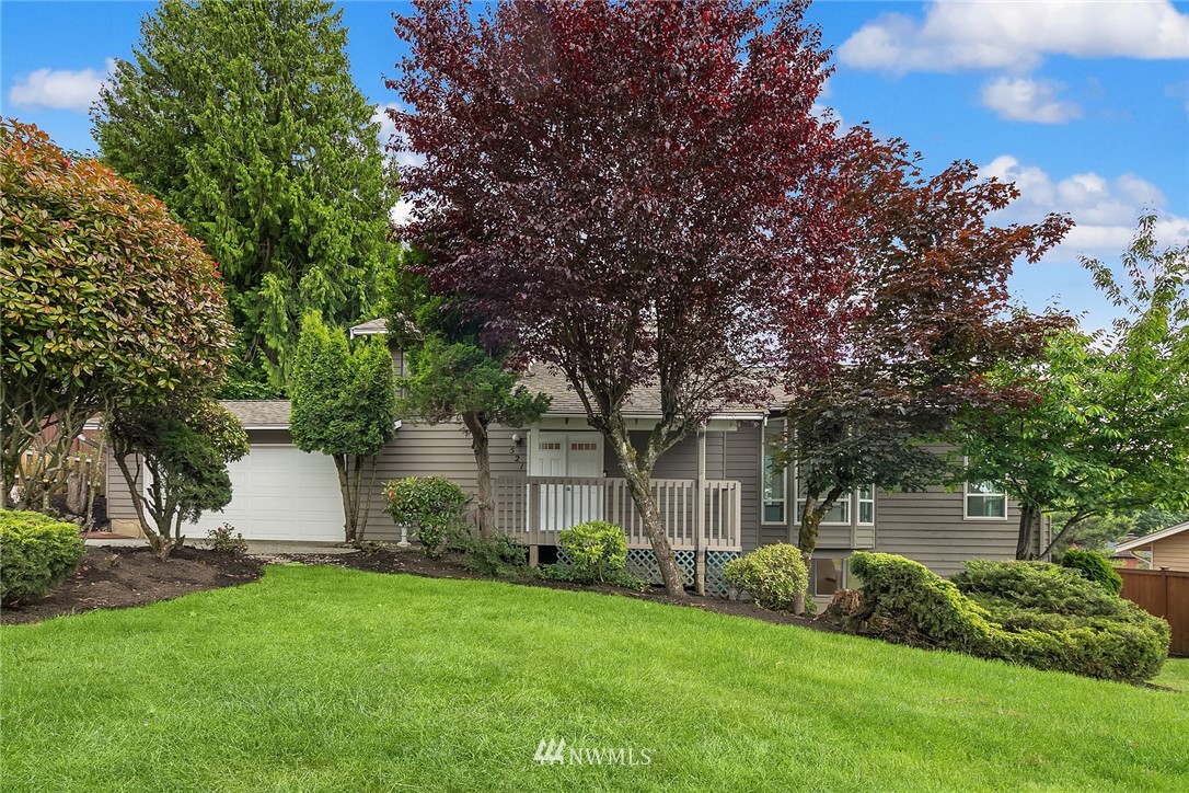 521 South 28th Place Renton, WA 98055 - Photo 1 of 20 a view of a house with a yard and a large tree