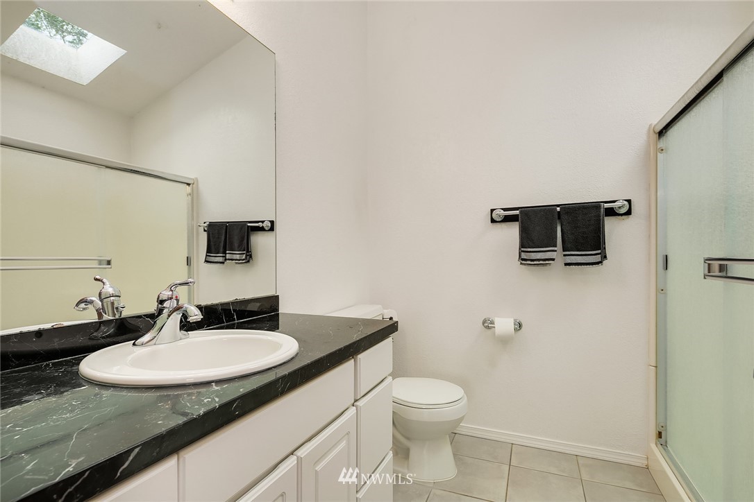 521 South 28th Place Renton, WA 98055 - Photo 11 of 20 a bathroom with a sink and a mirror