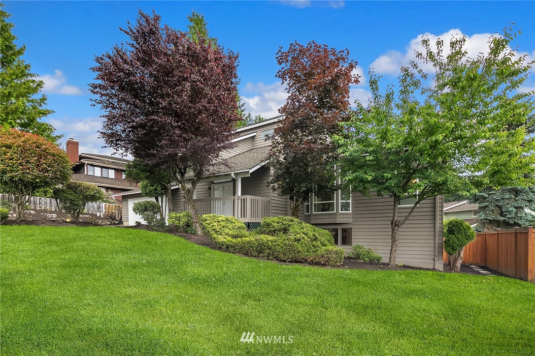 521 South 28th Place Renton, WA 98055 - Photo 18 of 20 a view of a house with a yard