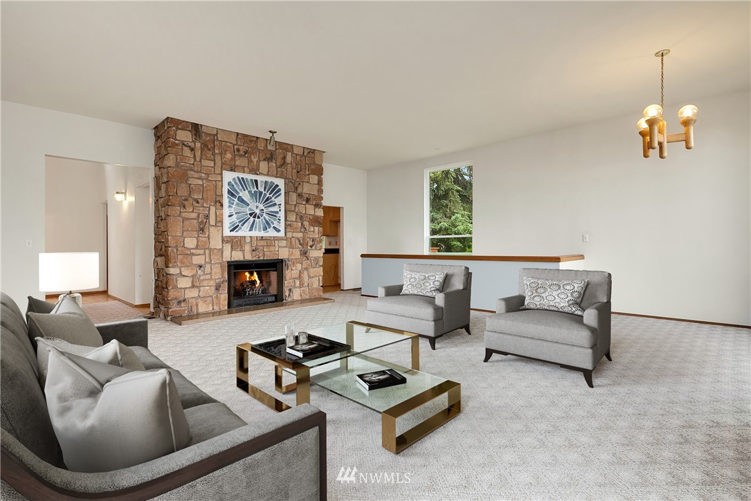 521 South 28th Place Renton, WA 98055 - Photo 7 of 20 a living room with furniture and a fireplace
