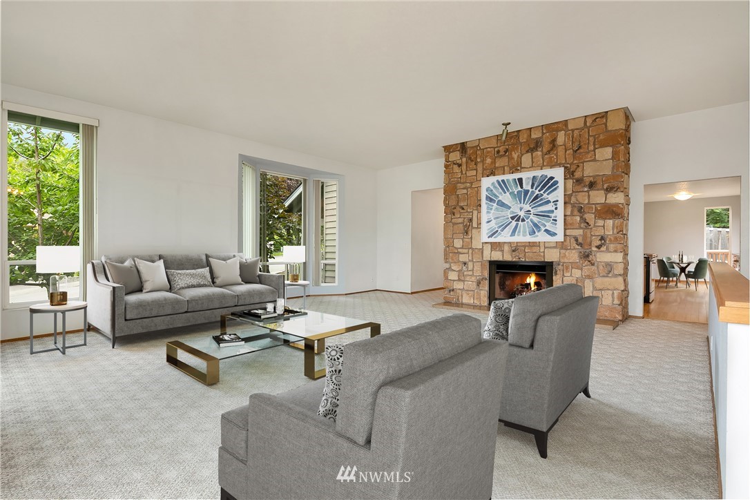 521 South 28th Place Renton, WA 98055 - Photo 8 of 20 a living room with furniture and a fireplace