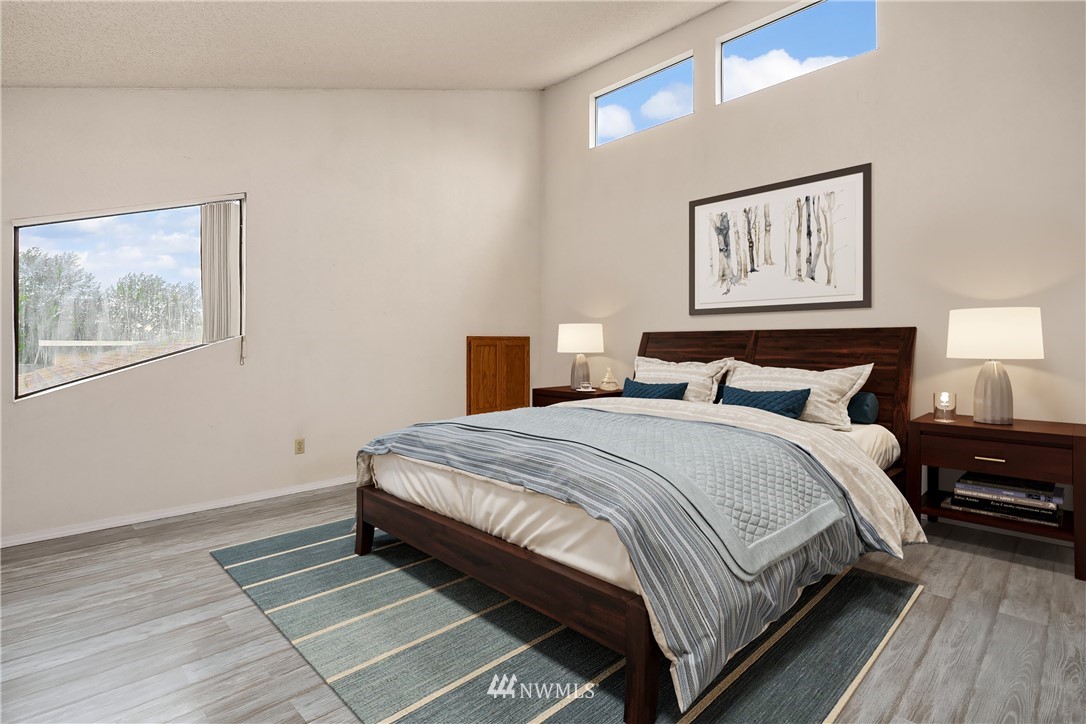 521 South 28th Place Renton, WA 98055 - Photo 10 of 20 a bedroom with bed and painting on the wall