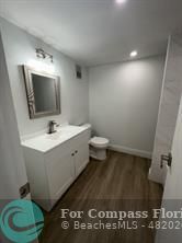 Undisclosed Address Fort Lauderdale, FL 33319 - Photo 14 of 19 a spacious bathroom with a toilet sink and mirror