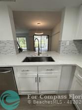 Undisclosed Address Fort Lauderdale, FL 33319 - Photo 4 of 19 a view of a kitchen with sink and window