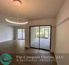 Undisclosed Address Fort Lauderdale, FL 33319 - Photo 5 of 19 a view of a room with an empty space and a window
