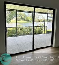 Undisclosed Address Fort Lauderdale, FL 33319 - Photo 8 of 19 a living room with a large window