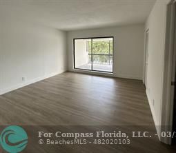 Undisclosed Address Fort Lauderdale, FL 33319 - Photo 9 of 19 an empty room with wooden floor