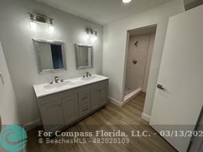 Undisclosed Address Fort Lauderdale, FL 33319 - Photo 10 of 19 a spacious bathroom with a double vanity sink and a mirror
