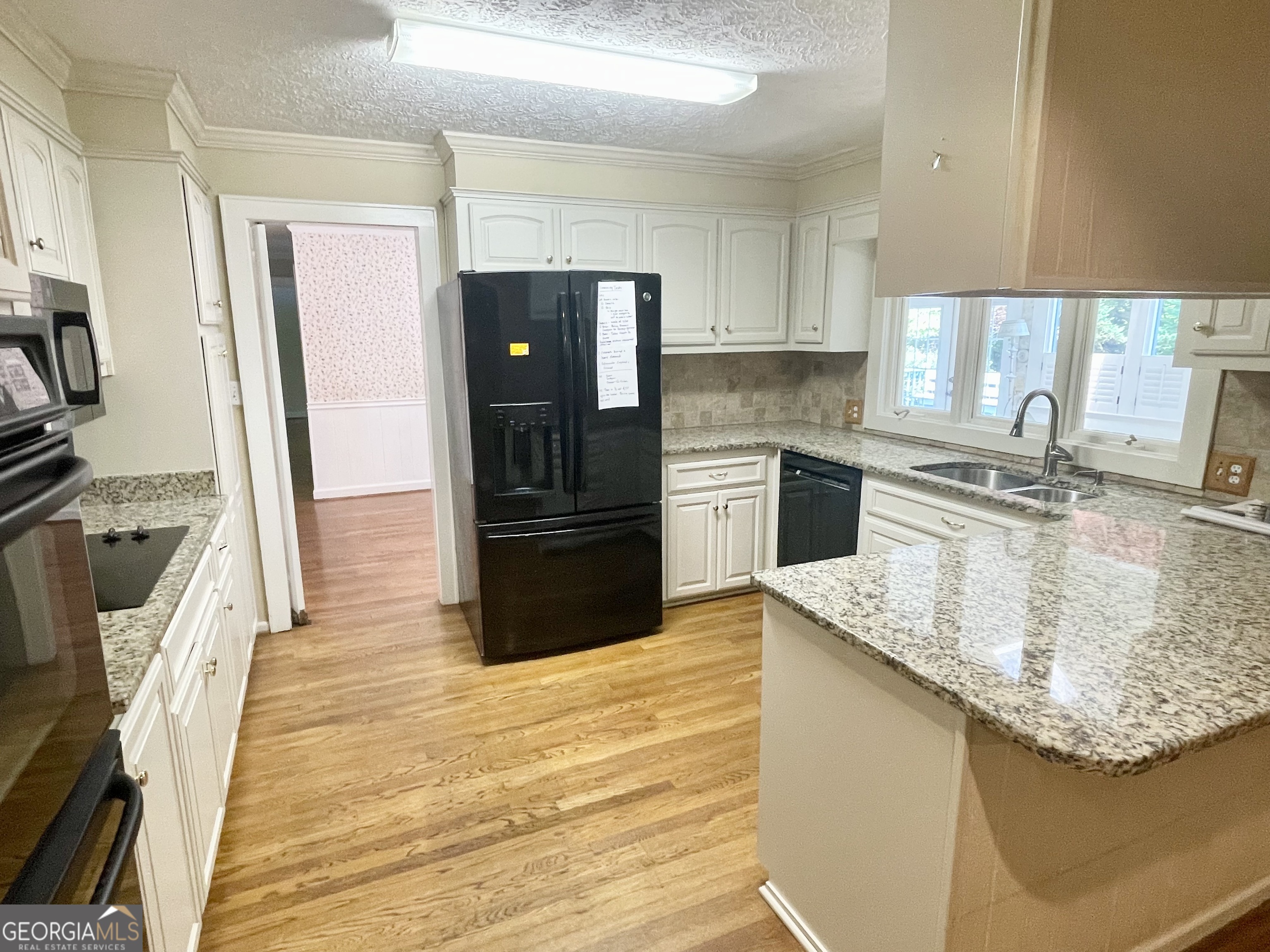 11 Cumberland Drive Southeast Rome, GA 30161 - Photo 13 of 29 a kitchen with stainless steel appliances granite countertop a sink stove and refrigerator