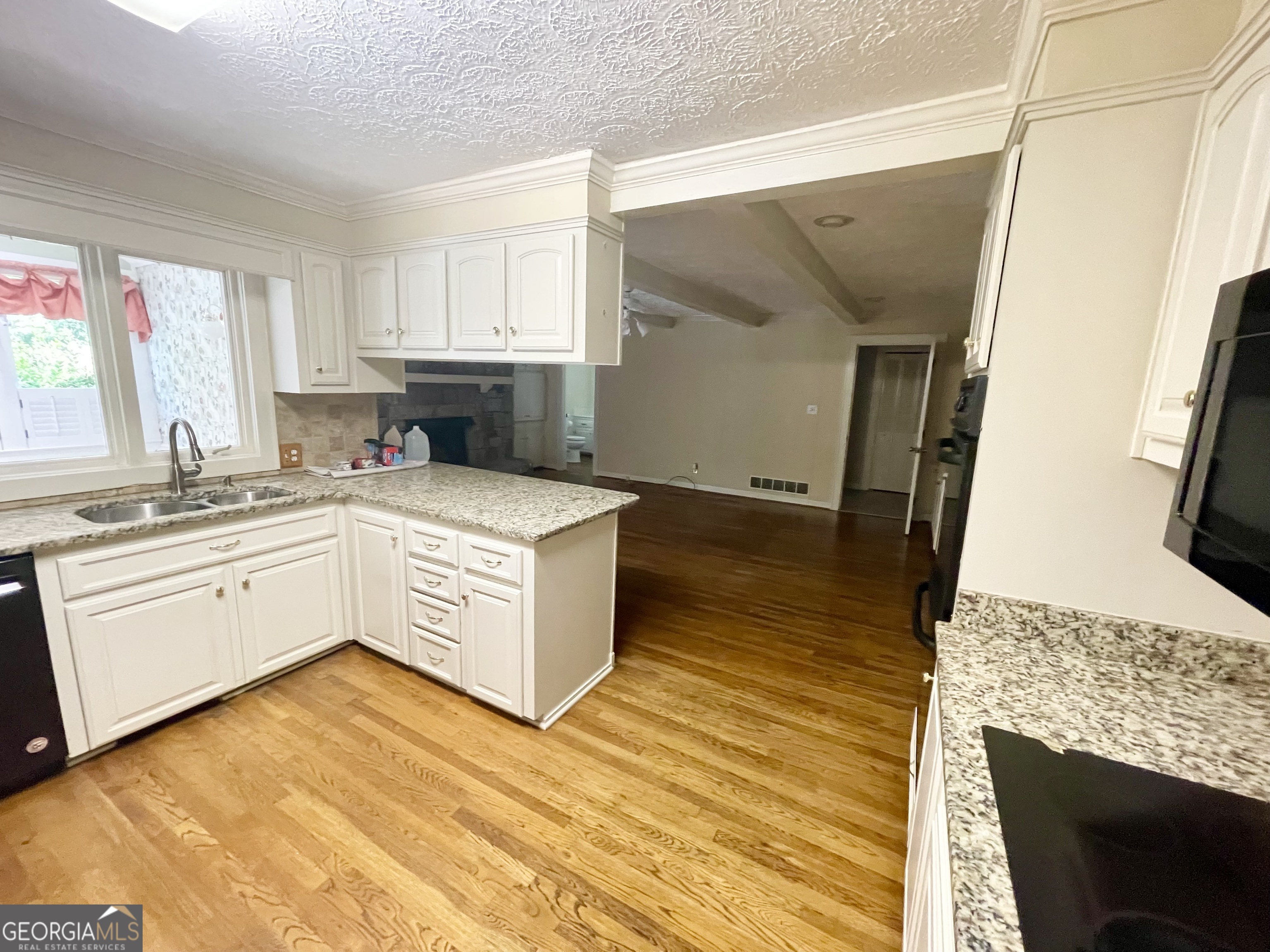11 Cumberland Drive Southeast Rome, GA 30161 - Photo 14 of 29 a kitchen with a sink stove and cabinets
