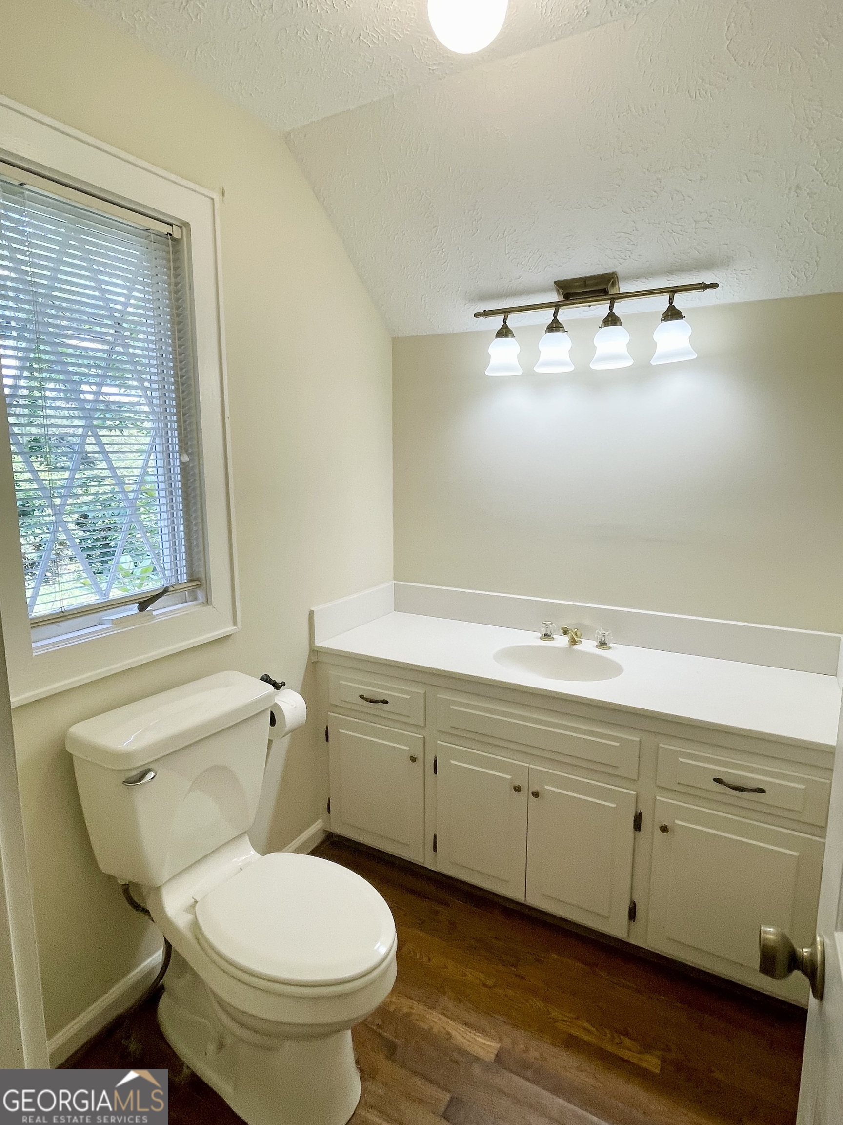 11 Cumberland Drive Southeast Rome, GA 30161 - Photo 17 of 29 a bathroom with a toilet sink and mirror