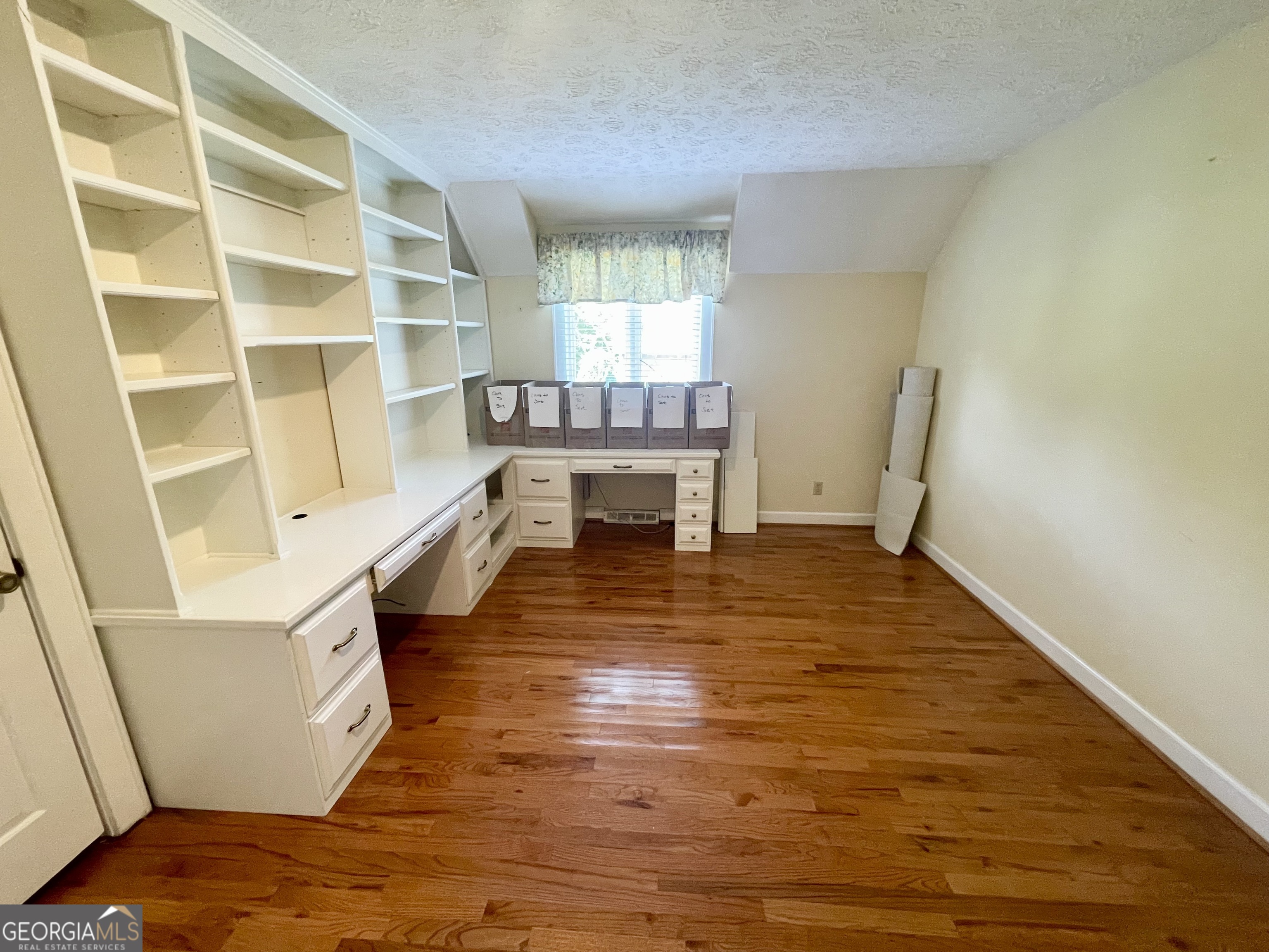 11 Cumberland Drive Southeast Rome, GA 30161 - Photo 24 of 29 a room with furniture and a wooden floor