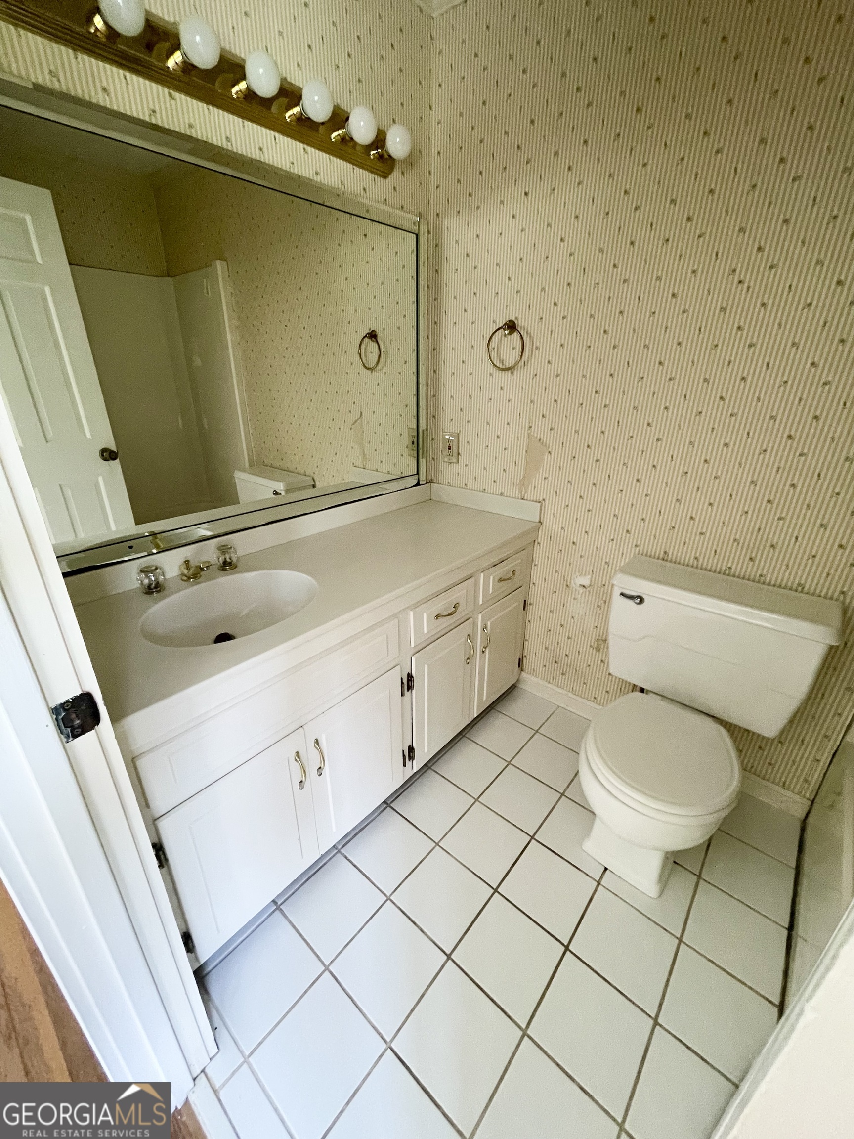 11 Cumberland Drive Southeast Rome, GA 30161 - Photo 27 of 29 a bathroom with a granite countertop sink and a mirror