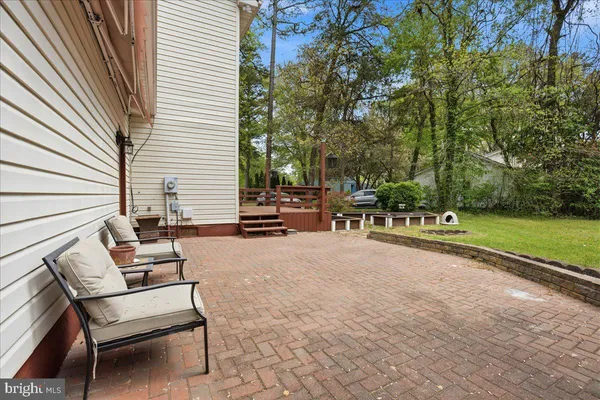 a view of a patio with chairs and a table