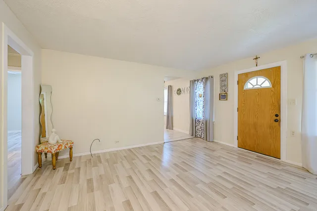 a kitchen with cabinets and white appliances