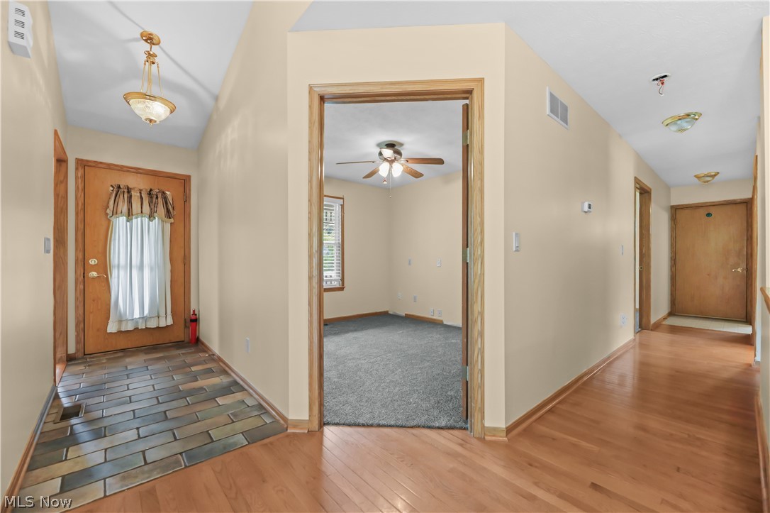 1701 Woods Road Akron, OH 44306 - Photo 7 of 43 Foyer entry, first bedroom, hallway to garage