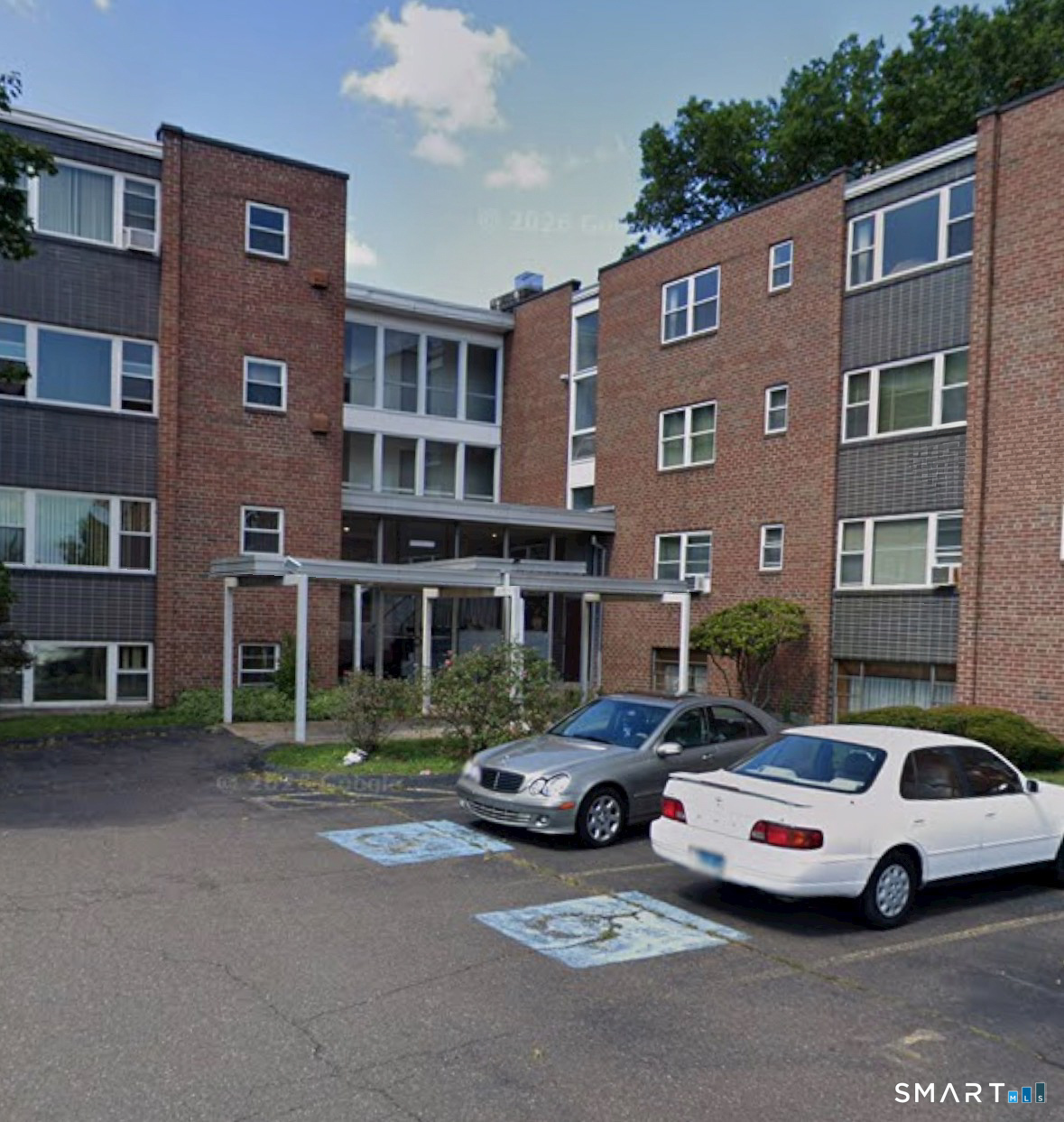 53 Wolcott Hill Road, Unit C12 Wethersfield, CT 06109 - Photo 1 of 25 a cars parked in front of a building
