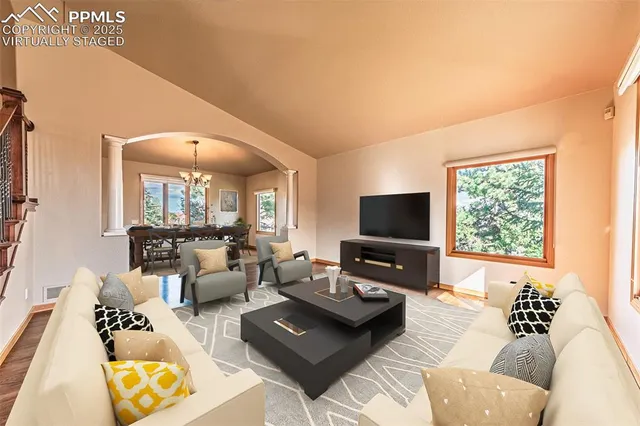 a large kitchen with cabinets and wooden floor