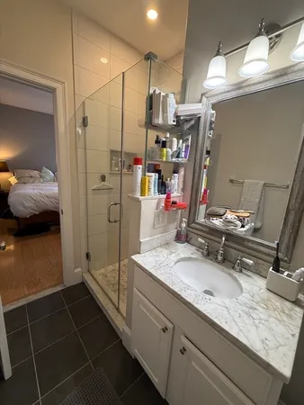 a bathroom with a sink and a mirror