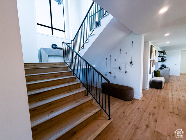 2132 East Outlaw Road, Unit 49 Kamas, UT 84036 - Photo 22 of 44 Stairs featuring wood-type flooring and baseboards