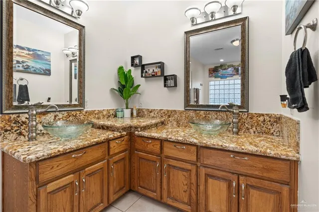 a kitchen with stainless steel appliances granite countertop a refrigerator and a stove
