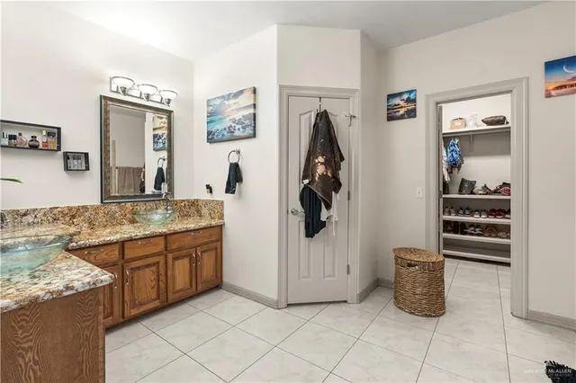 a bedroom with furniture and flat screen tv